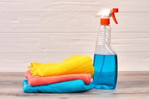 Cleaning spray bottle with plastic dispenser.